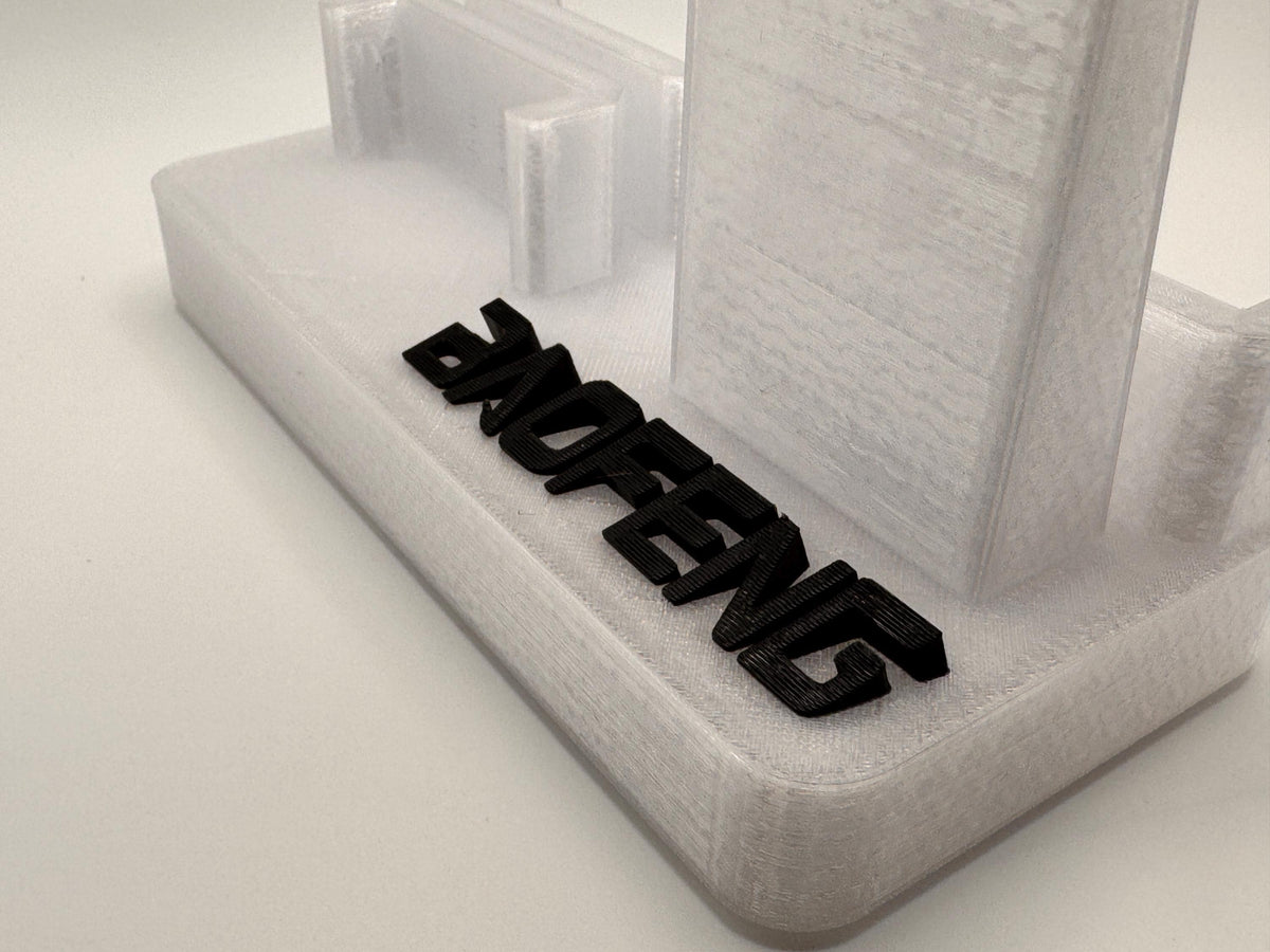 Baofeng UV-5R 25th anniversary transparent desk stand – Baofeng logo close-up