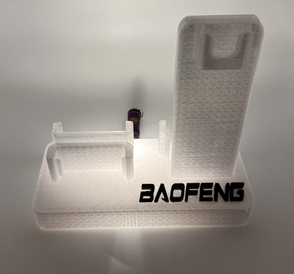 Baofeng UV-5R 25th anniversary transparent desk stand – empty stand lit view