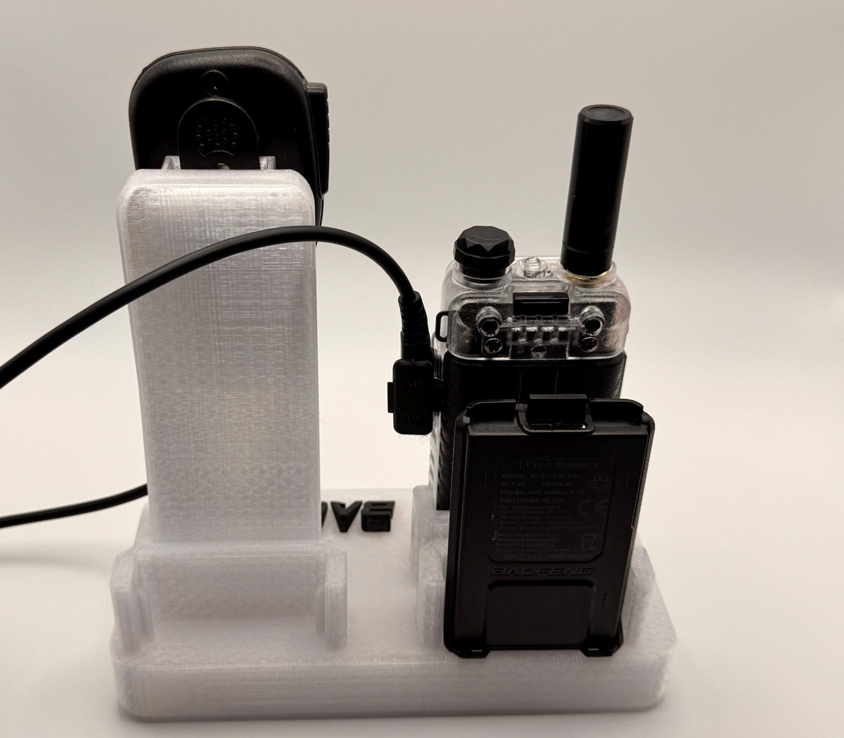 Baofeng UV-5R 25th anniversary transparent desk stand – rear view with radio and battery
