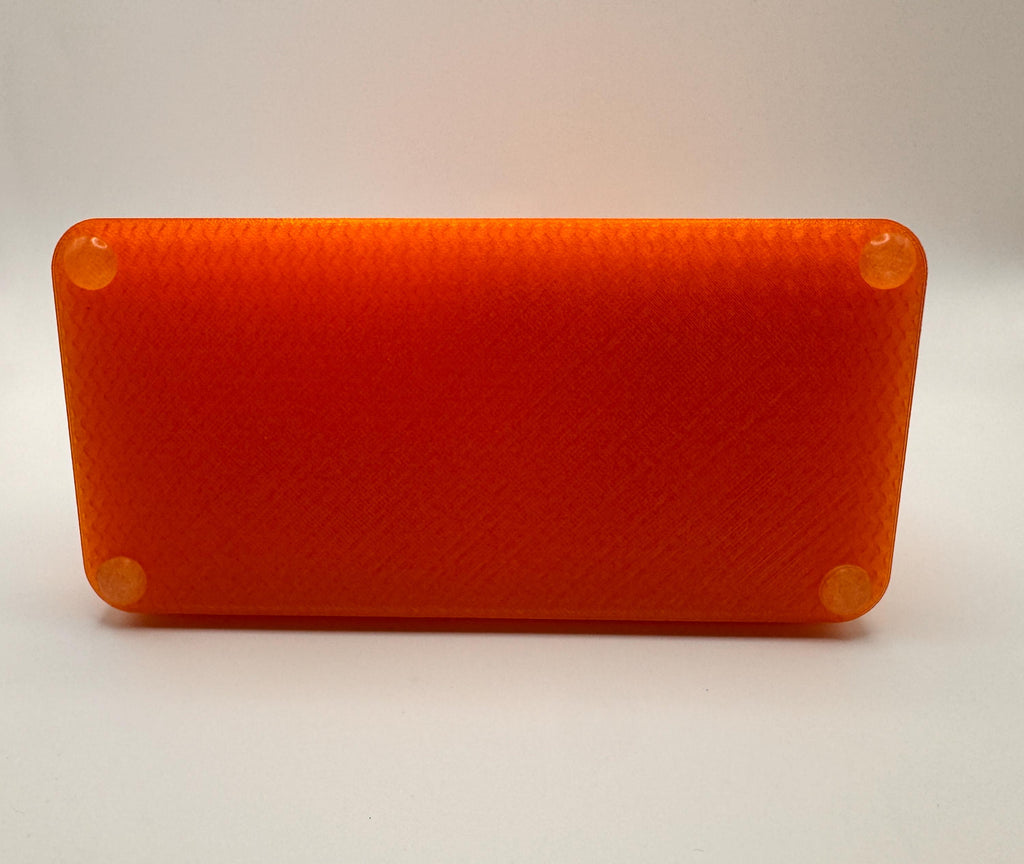 Baofeng UV-5R 25th anniversary transparent orange desk stand – base underside