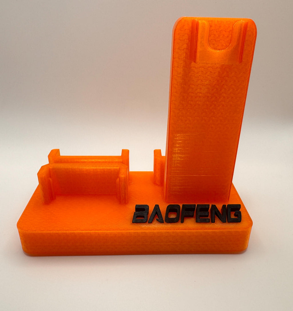 Baofeng UV-5R 25th anniversary transparent orange desk stand – empty stand front view
