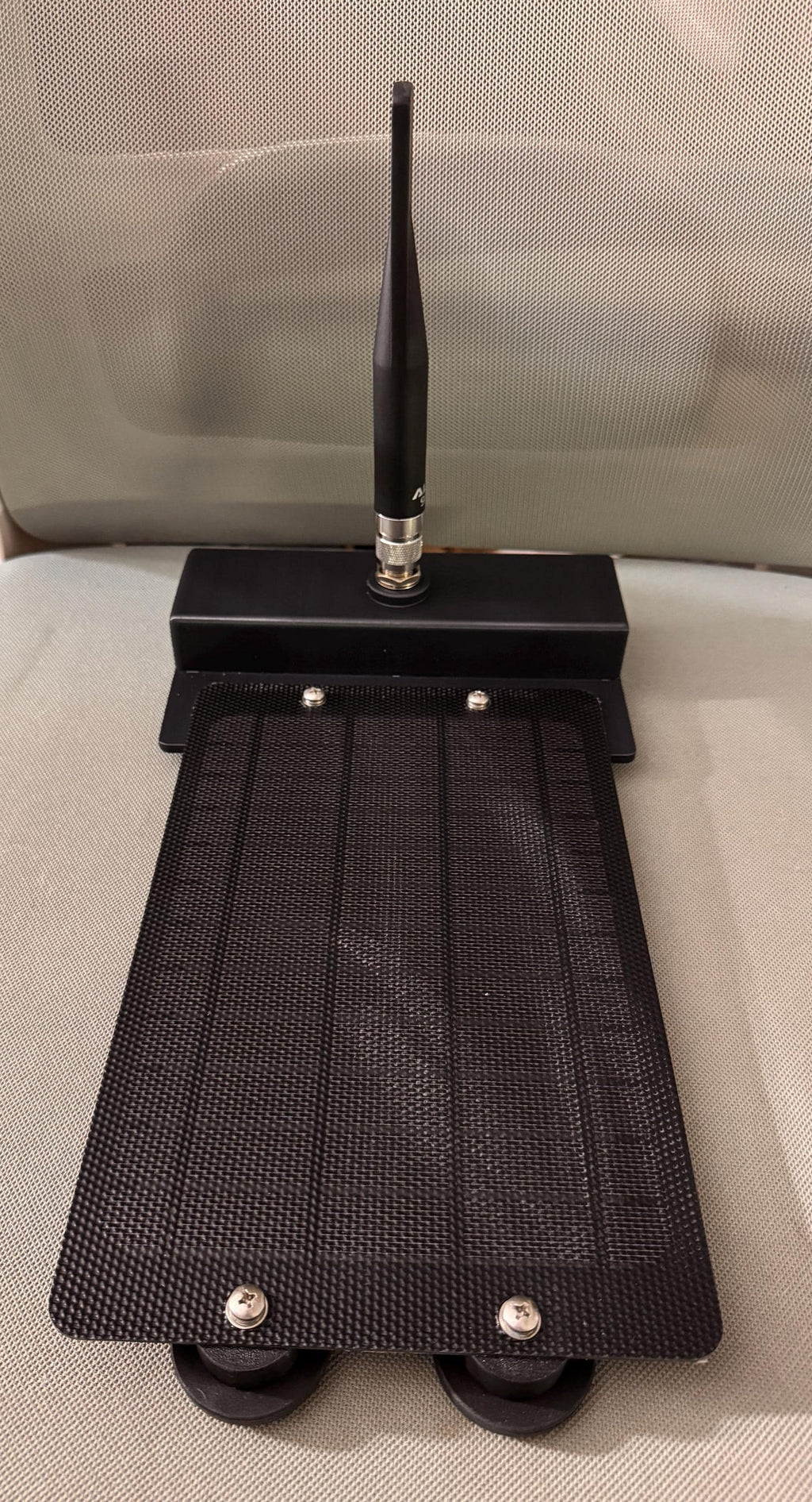 Meshtastic solar node housing – assembled node with antenna, front view